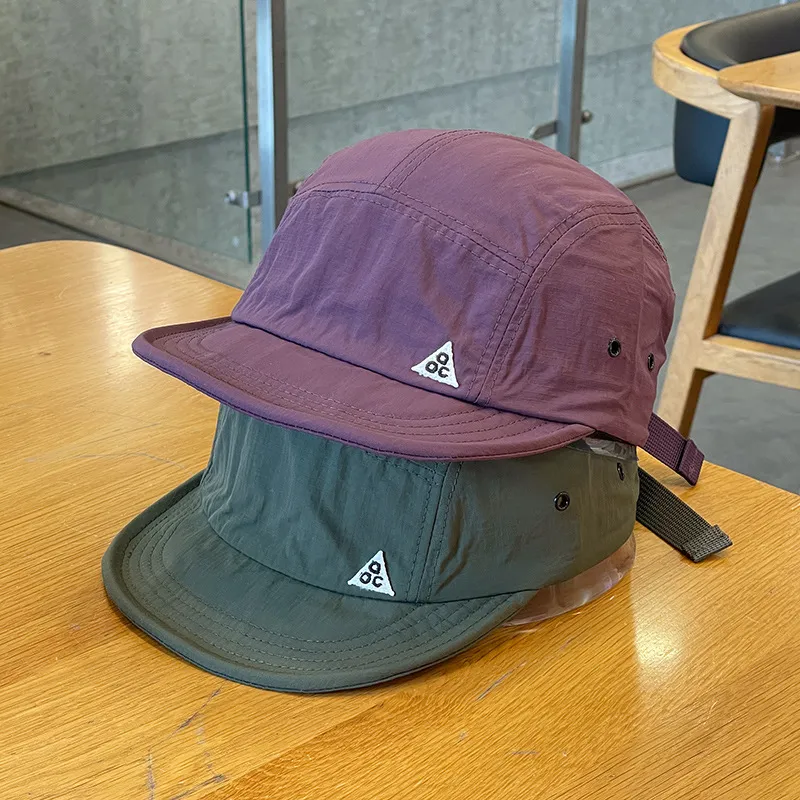 Man wearing a vintage inspired Japanese baseball cap in a stylish streetwear setting